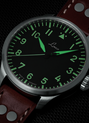Lume shot of Laco Augsburg 42 Type A Automatic Pilot Watch front view with black Flieger dial