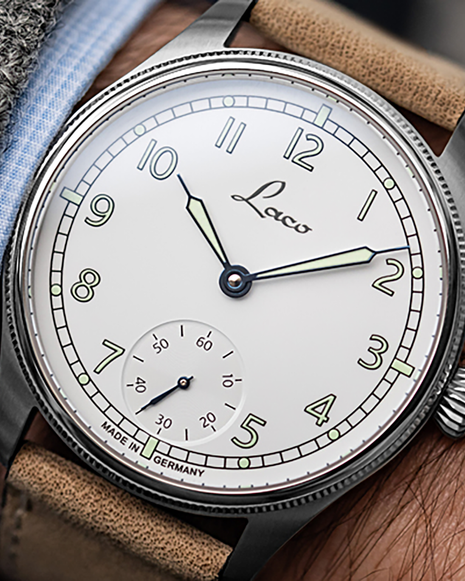 Wristshot of Laco Cuxhaven 42.5 Hand-Wound Navy Watch with white enamel-look dial, small seconds and light-coloured leather strap