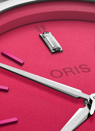Close-up of pink dial and baguette-cut lab-grown diamond on Oris Miss Piggy Edition