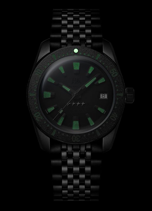 Lume shot of Shanghai Watch Commander Sniper 37.5mm automatic watch with black dial and gunmetal case