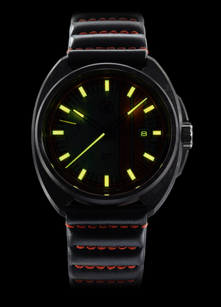 Lume shot of Zelos GT 42mm Carbon Heritage automatic watch with light blue dial and orange racing stripes